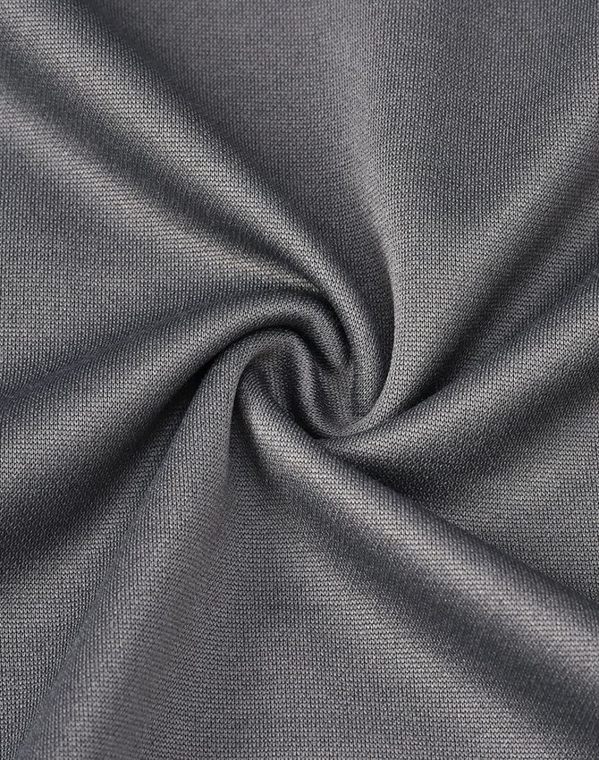 A close-up view of grey fabric, showcasing a smooth texture with a subtle sheen and a twisted pattern.