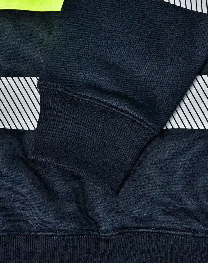 A close-up of a navy work jumper featuring reflective stripes and a high-visibility yellow neckline, with ribbed cuffs.