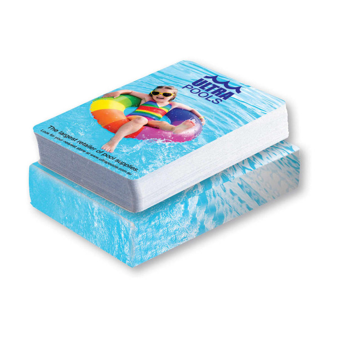 A deck of playing cards featuring a design of a child in a colorful float on a blue water background.