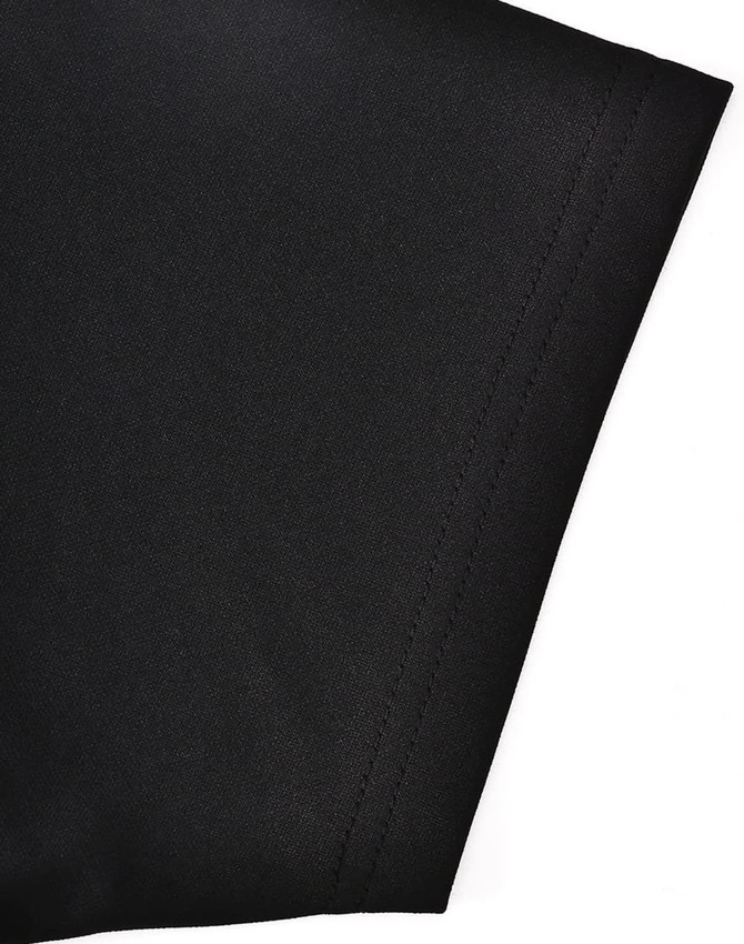 A close-up of the sleeve of a black polo shirt made from sustainable poly/cotton blend, featuring a logo.