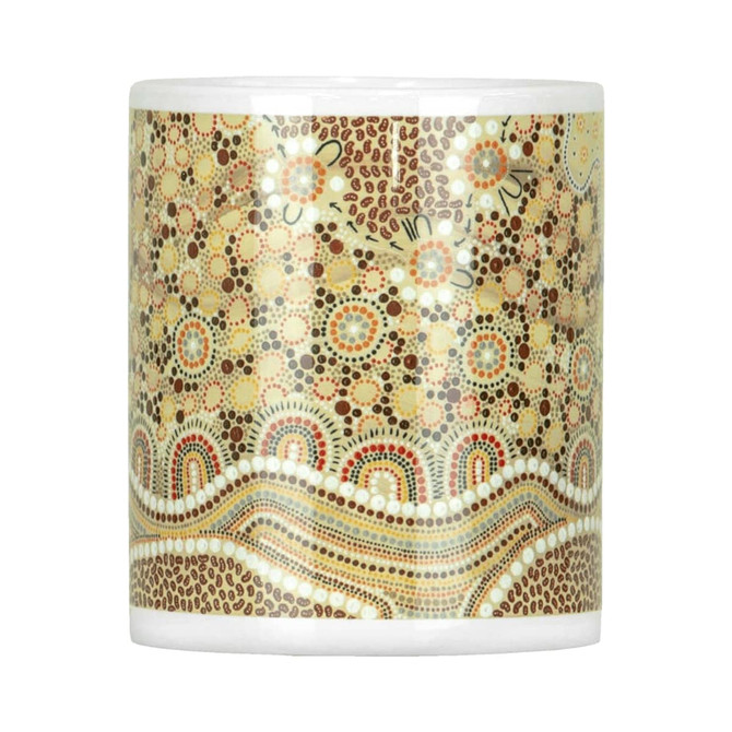 A ceramic mug featuring a decorative pattern in earthy tones of brown, orange, and cream. It comes in a box.