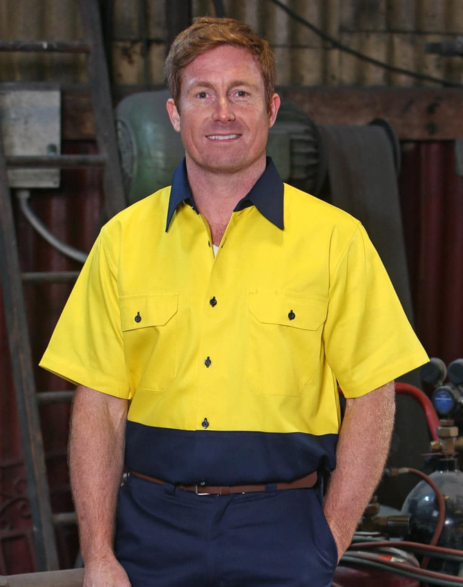 A short-sleeved Hi-Vis work shirt in yellow and navy with a logo and button details.