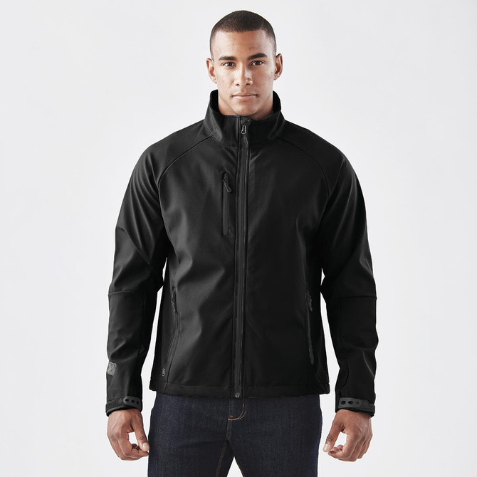 A black ultra-light shell jacket with a zip front and side pockets, featuring a logo on the sleeve.