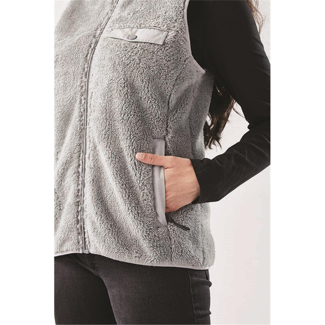 A women's grey Sherpa fleece vest with a zip, featuring a chest pocket and side pockets.