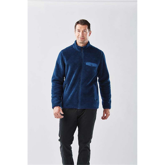 A men's navy Bergen sherpa fleece jacket with a zip front and a chest pocket, featuring a logo.