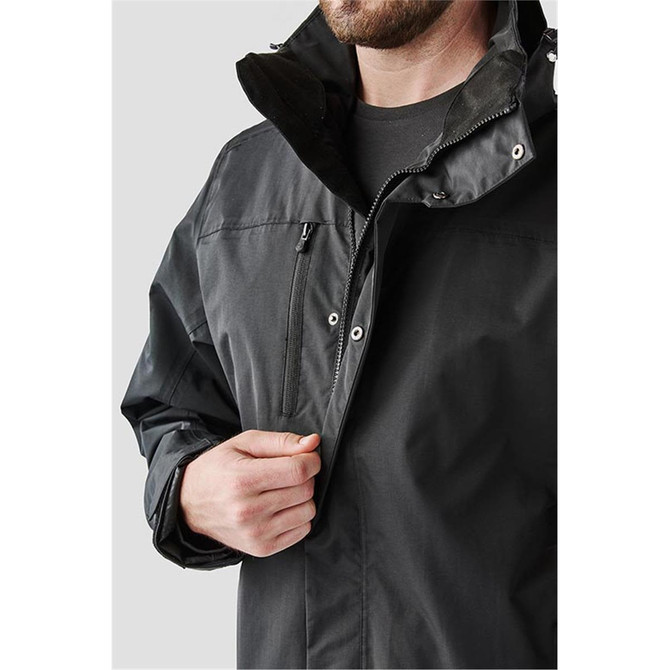 A black men's jacket with a zippered pocket and a high collar, featuring a logo on the side.