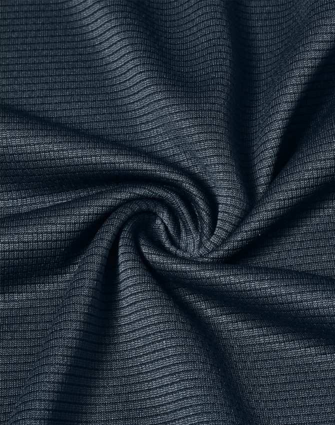 A close-up of navy textured fabric, showcasing a lightweight material with a subtle grid pattern.