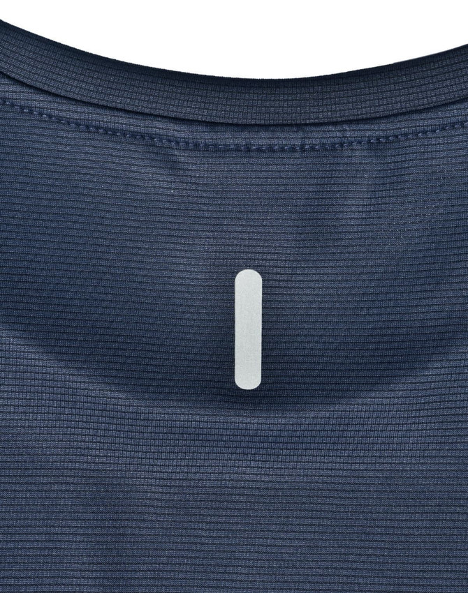 A close-up of a navy blue ladies' ultra lightweight performance t-shirt, featuring a subtle logo at the neckline.