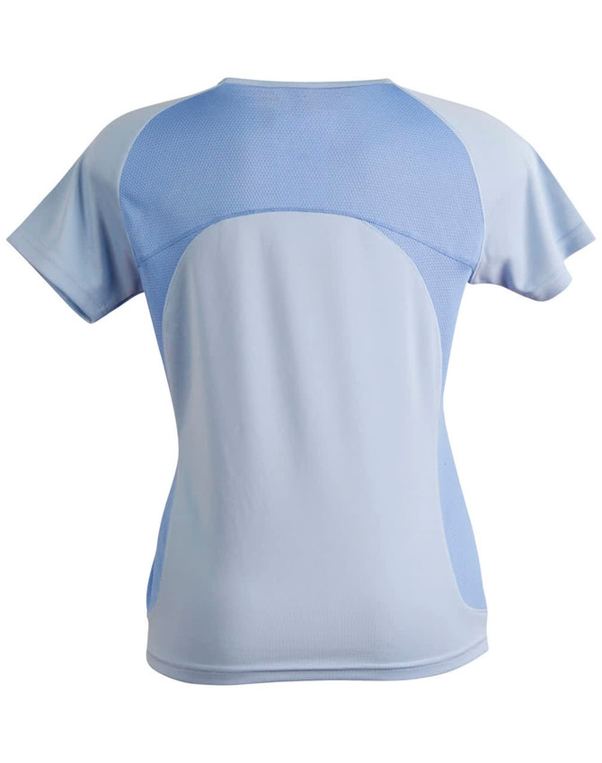 A light blue ladies' tee shirt featuring a mesh back and a logo. The design is sporty and fitted.