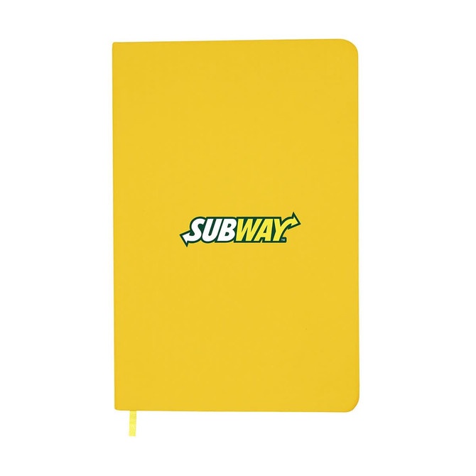 A yellow A5 notebook features an emblem and has a ribbon bookmark. It has a smooth cover and rounded edges.