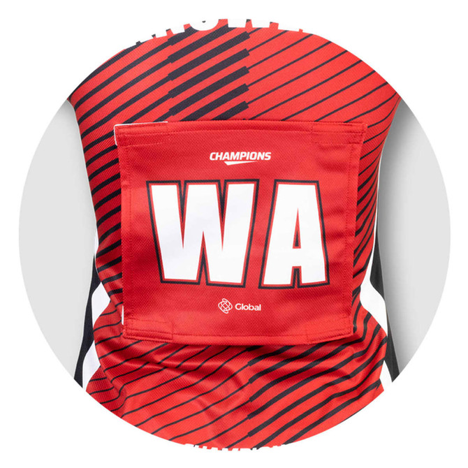 A red netball bib featuring bold stripes and a pocket for a number, with a logo present.