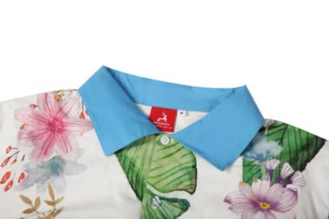 A floral-patterned shirt featuring a blue collar. The design includes various flowers and green leaves.