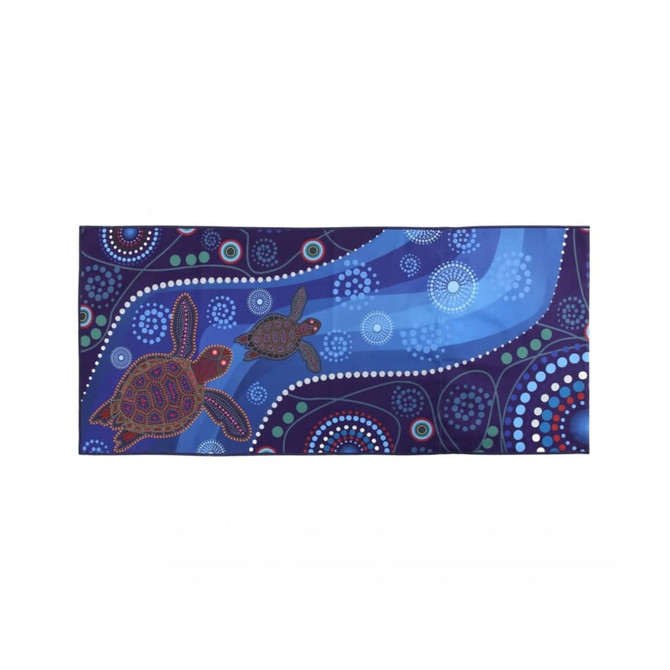 A spread towel featuring a vibrant design with turtles and circular patterns in shades of blue and purple.