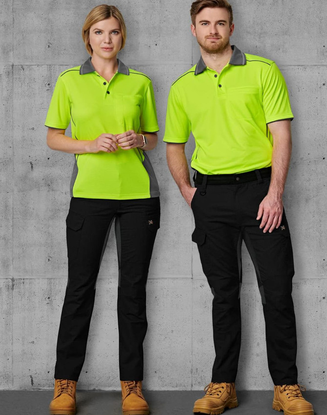 A pair of models wears bright green and grey work shirts with black rip-stop poly/cotton stretch work pants.