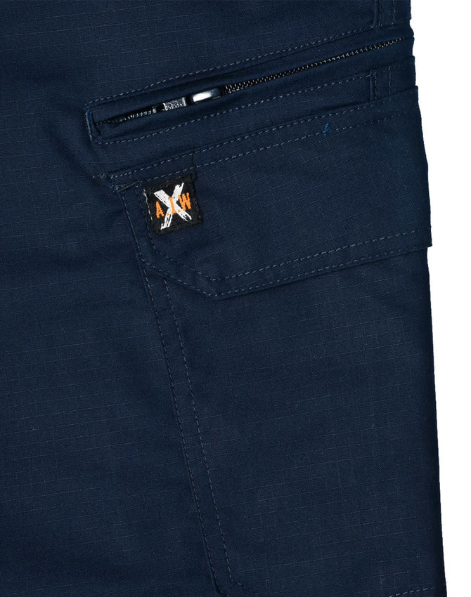 A pair of navy blue work pants featuring a zip pocket and a branded logo. Made from rip-stop poly/cotton stretch material.