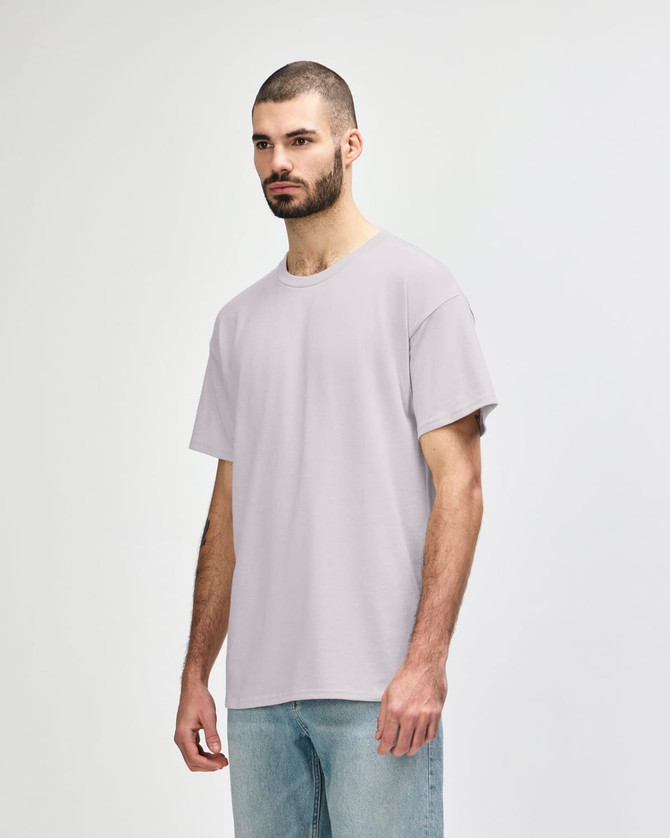 A light grey Gildan Softstyle adult T-shirt displayed on a model, featuring a relaxed fit and no visible logo.