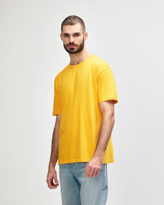 An orange Gildan Softstyle adult T-shirt is displayed on a model in profile view.