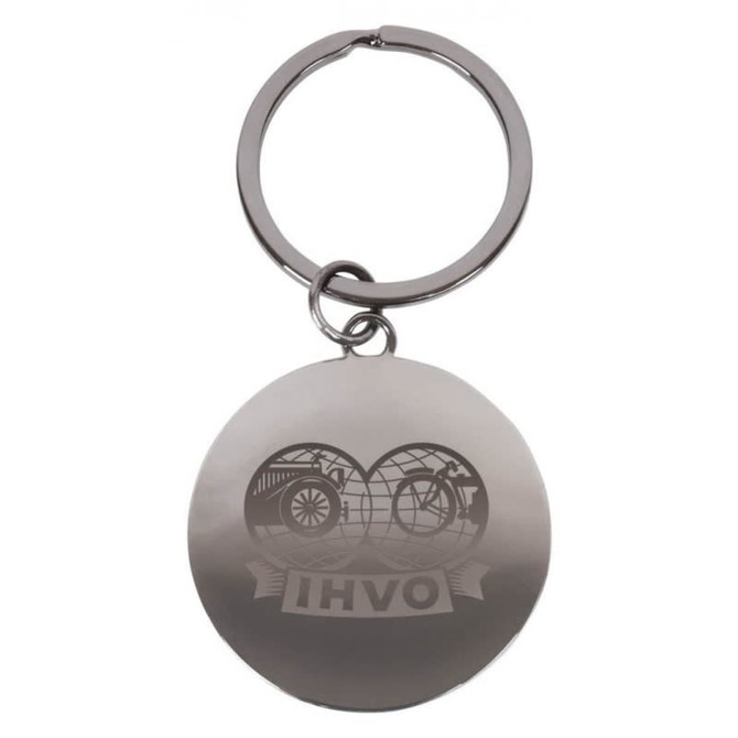 A silver round keychain featuring a logo, attached to a metal ring.