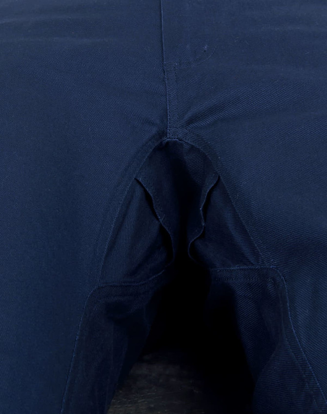Unisex cotton stretch ripstop work pants in navy blue with a detailed view of the crotch area. Features a logo.