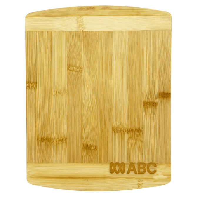 A bamboo cutting board with a smooth surface and rounded edges, featuring a logo in one corner.