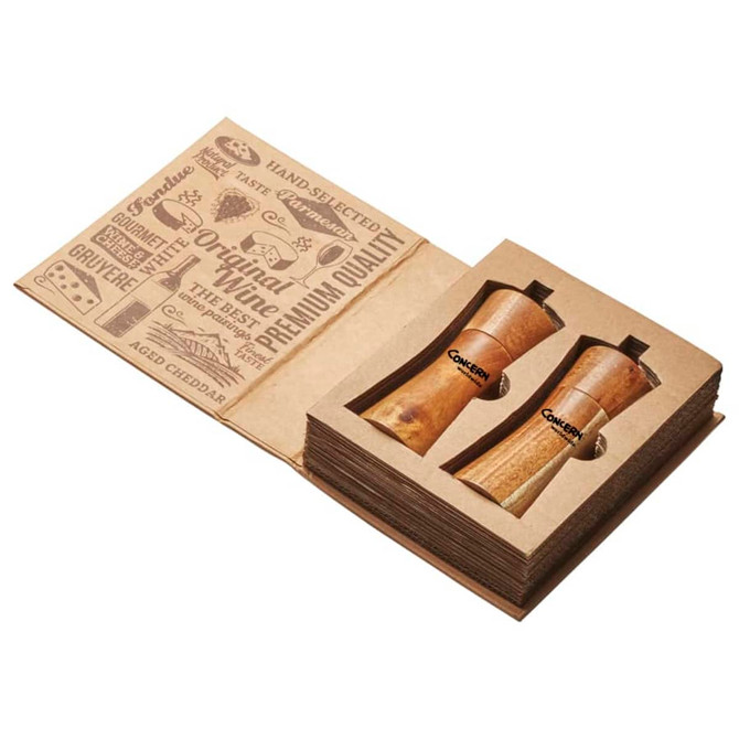 A wooden salt and pepper set in a presentation box, featuring a simple logo on each grinder.