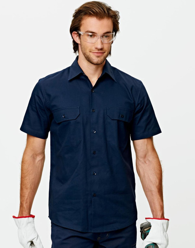 A navy short-sleeved work shirt with two chest pockets and a logo, worn by a man wearing glasses and gloves.