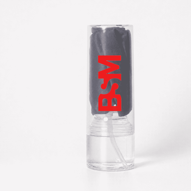 A clear container holds a dark grey cleaning cloth, featuring a logo in red.