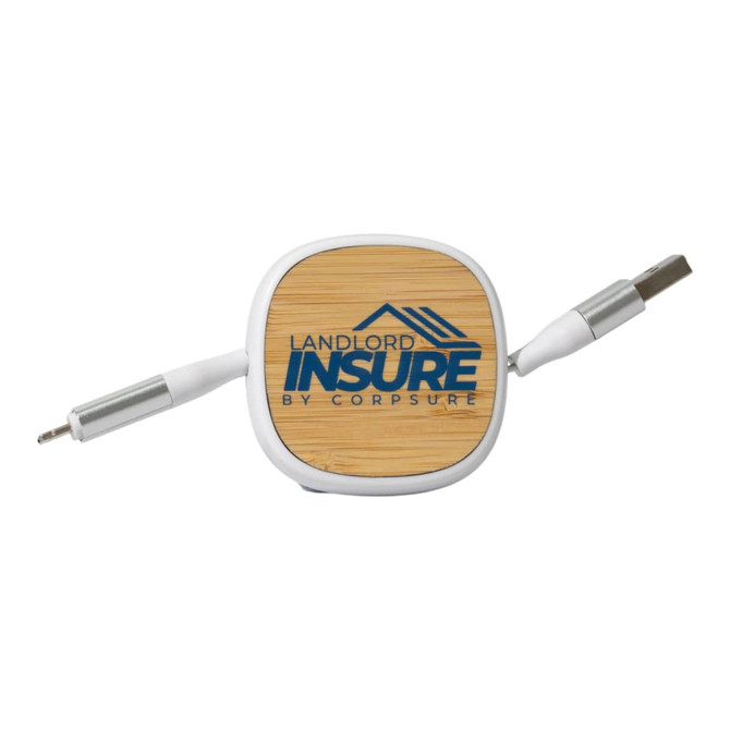 A square charging cable organiser in white and bamboo, featuring a logo on the top and dual connectors on each side.
