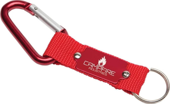 A red keyring featuring a metal carabiner and a fabric strap with a logo.