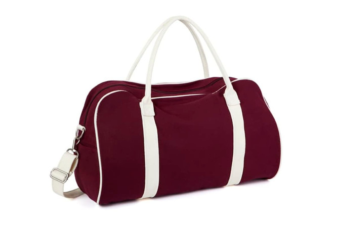 A maroon bag with white accents and handles, featuring a shoulder strap and a logo.
