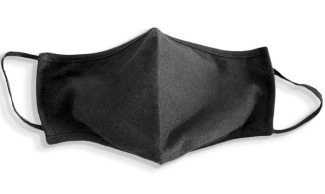 A black face mask made from 100% cotton, featuring ear loops and a plain design. It has a logo on one side.