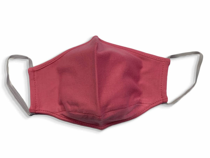 A red face mask made from 100% cotton with grey ear straps and a logo.