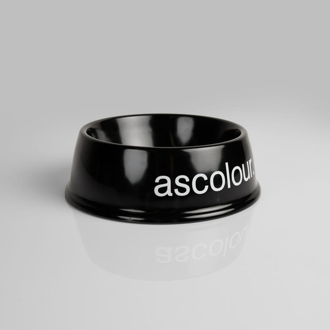 A black pet bowl with a glossy finish and a branding logo. Ideal for pet accessories.
