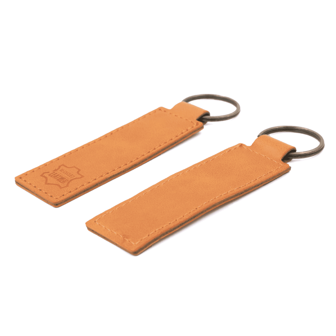A tan recycled leather keyring featuring a metal ring for attachment and a logo embossed on one side.