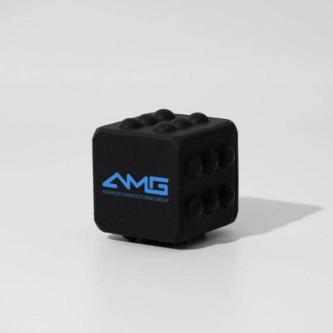 A black silicone cube with raised dots and a logo in blue.