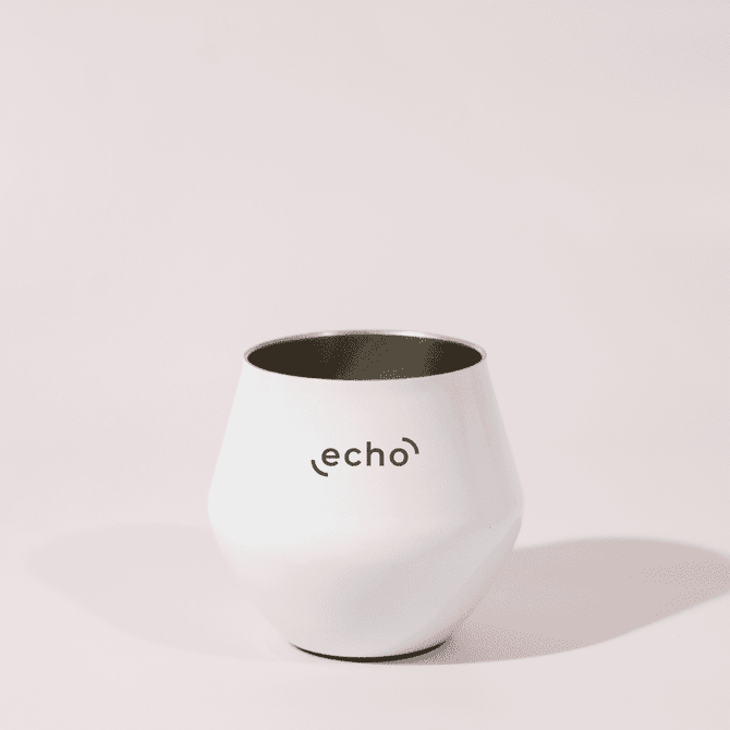 A white, detachable wine glass with a sleek design and a logo on the front.