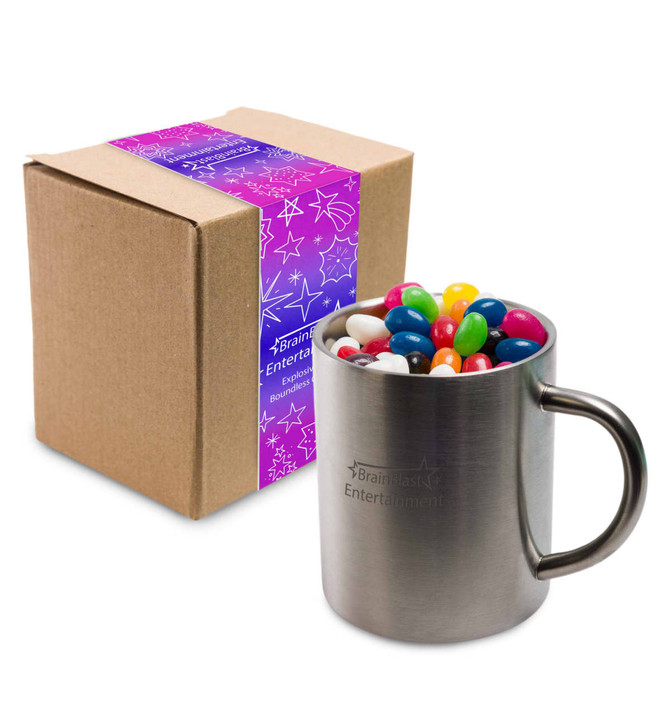 A Java mug filled with assorted color mini jelly beans, placed next to a packaged box.