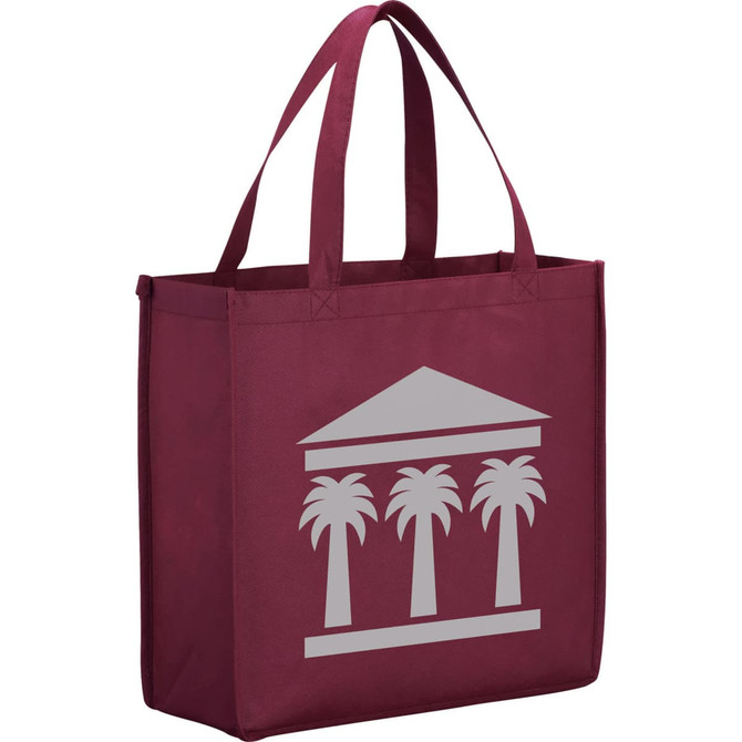 A maroon non-woven tote bag with a logo featuring a building and palm trees. Spacious design with handles for easy carrying.