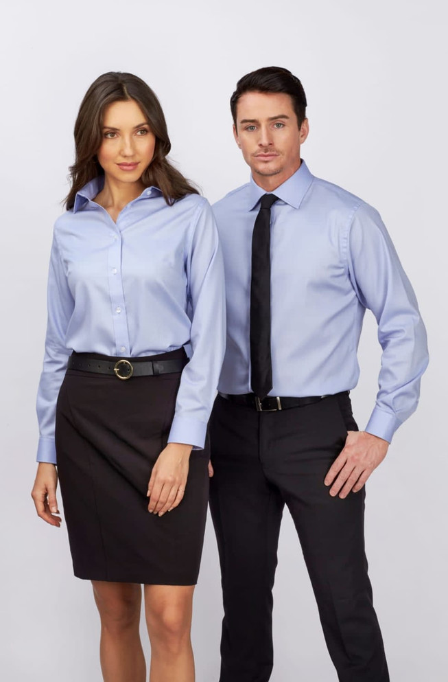 A men's long sleeve button-up shirt in light blue, displayed alongside a model wearing a matching shirt.