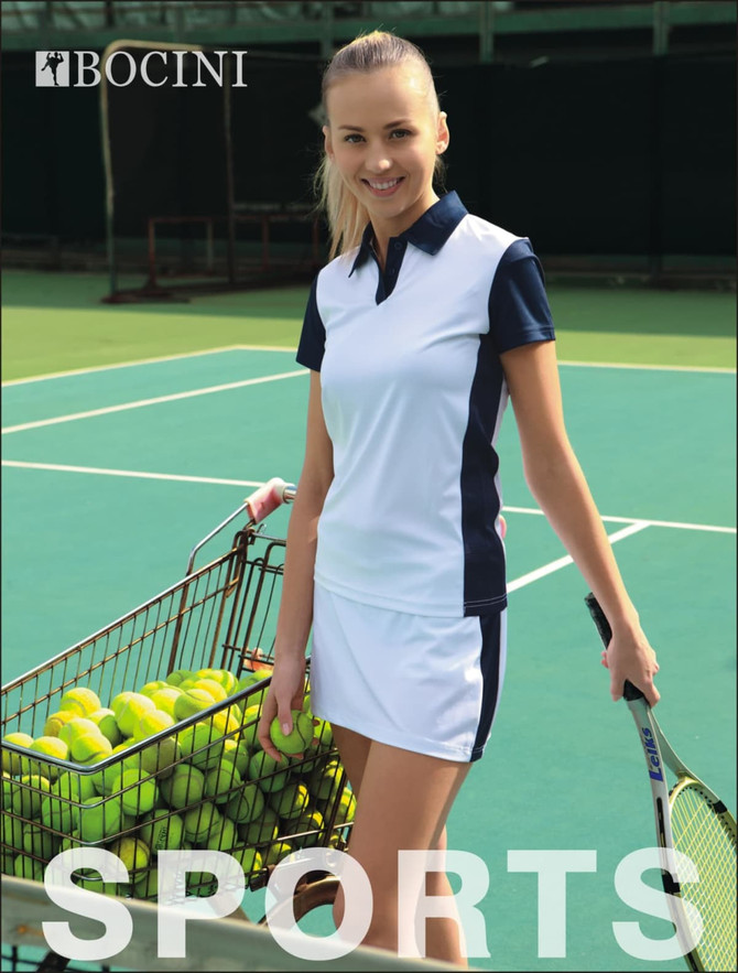 A polo shirt in white and navy, featuring a logo, displayed with a tennis player and a cart of tennis balls on a court.