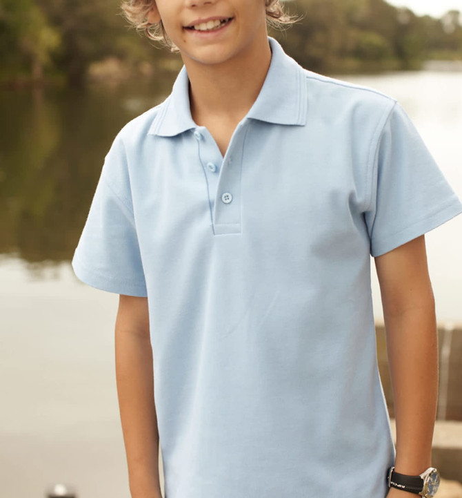 A light blue kids' polo shirt with a collar and button placket, featured in an outdoor setting.