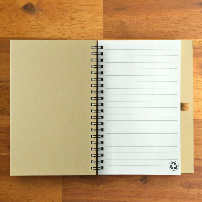 A spiral-bound notebook with a kraft paper cover and lined pages, featuring a small logo on the bottom.