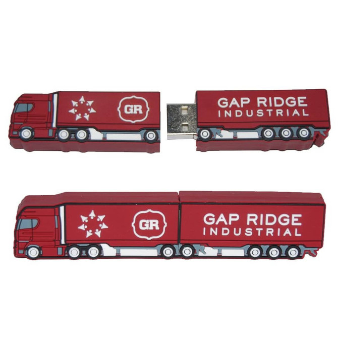 A red USB flash drive shaped like a truck, featuring a logo on the side and a detachable connector.