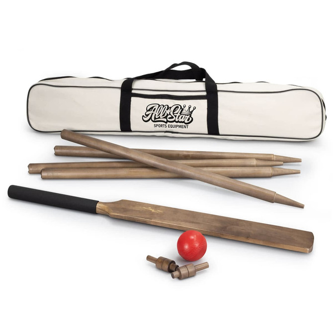 A Boundary Cricket Set featuring wooden bats, stumps, and a red ball, all stored in a cream carry bag with a logo.
