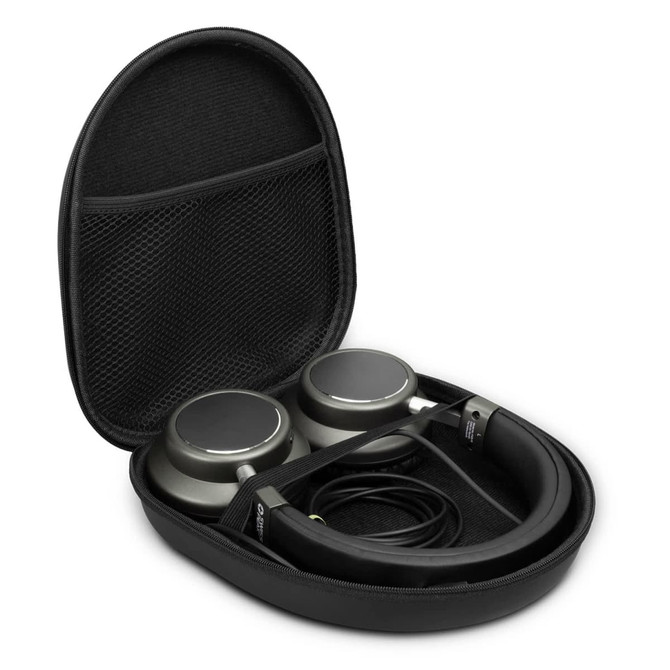 A set of green wireless headphones placed inside a black protective case with a mesh pocket for accessories.