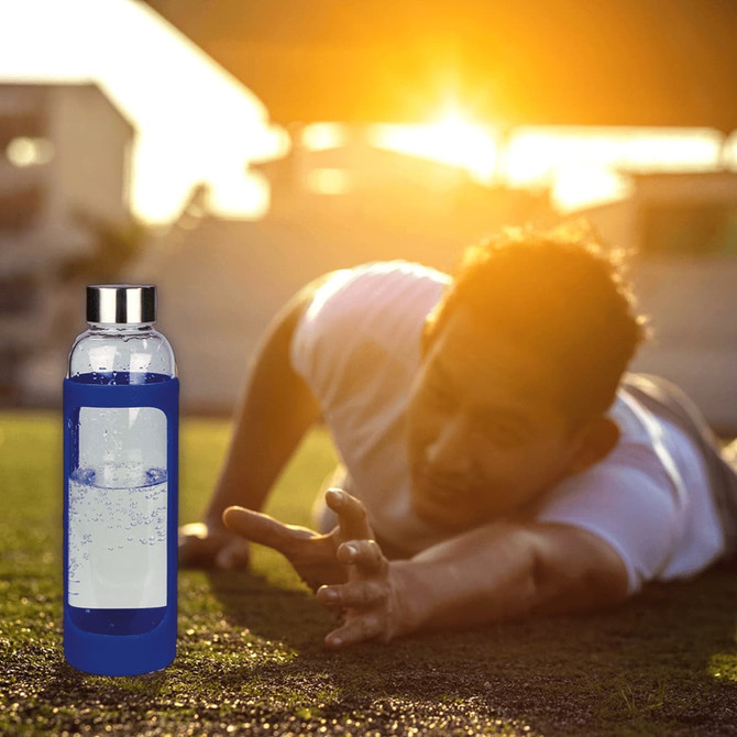 A drink bottle with a blue silicone cover and clear glass body, featuring a metal lid.