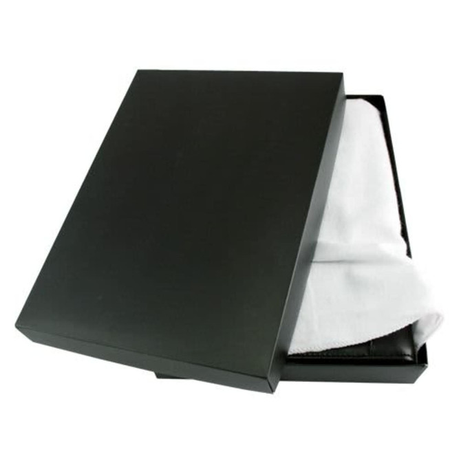A black box slightly open, revealing a white cloth covering a dark leather compendium inside.