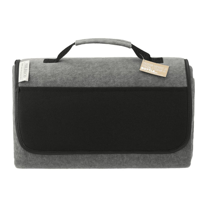 A grey oversized picnic rug with a black handle and front pocket, featuring a logo.