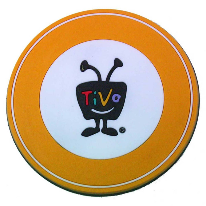 A circular PVC coaster featuring a white centre with a black logo and an orange rim.