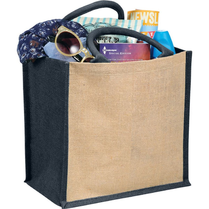 A medium jute tote bag in black and natural with various items, including a magazine, sunglasses, and a scarf inside.